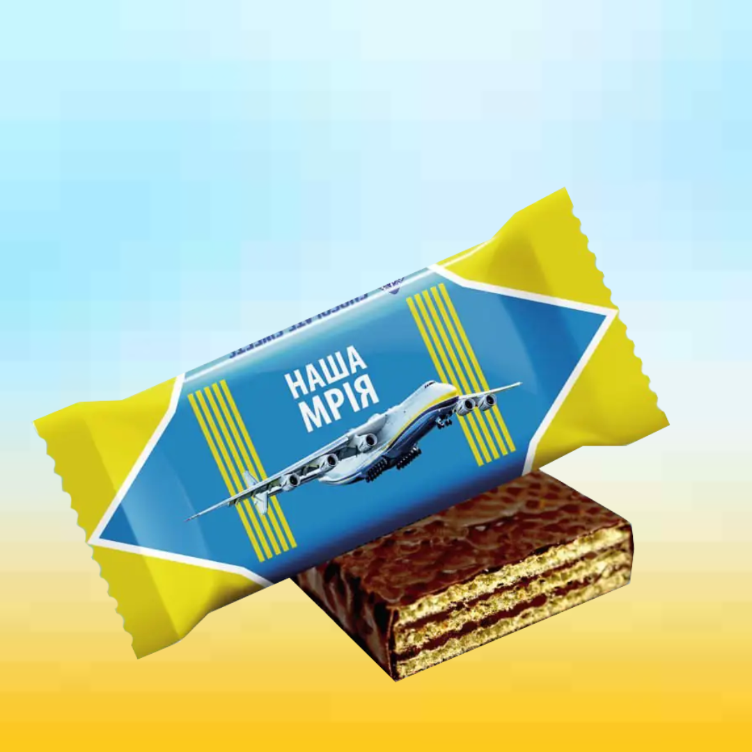a piece of chocolate cake with a wrapper on top of it