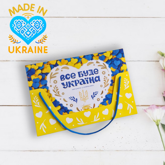 a yellow and blue bag sitting on top of a white table