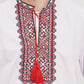 a man wearing a white shirt with a red tassel