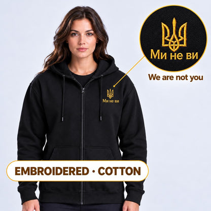 Women's Black Ukrainian Zip-Up Hoodie with Gold Tryzub Embroidery, “Ми не ви” Left Chest Design, 80/20 Cotton Blend, Mad