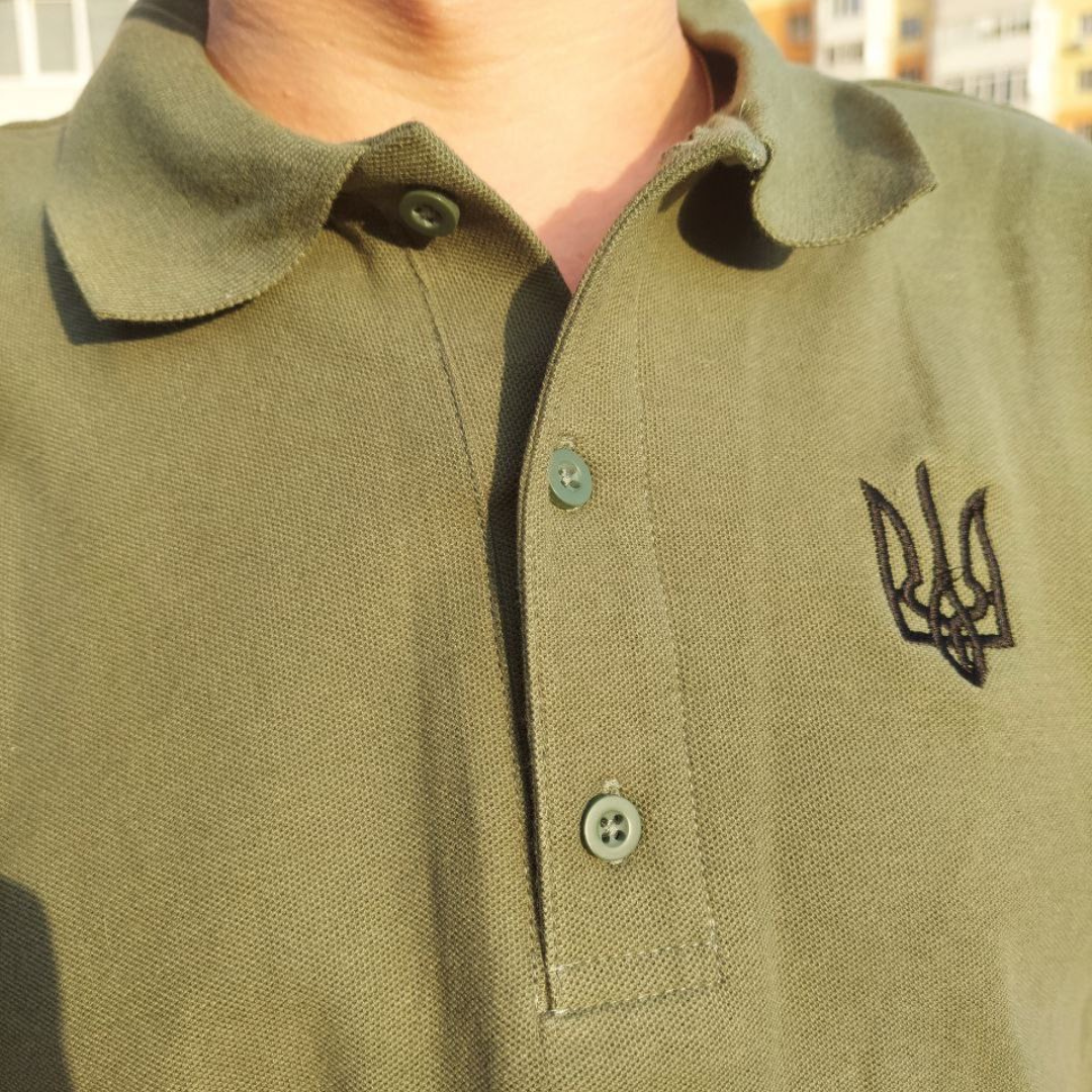 a close up of a person wearing a polo shirt