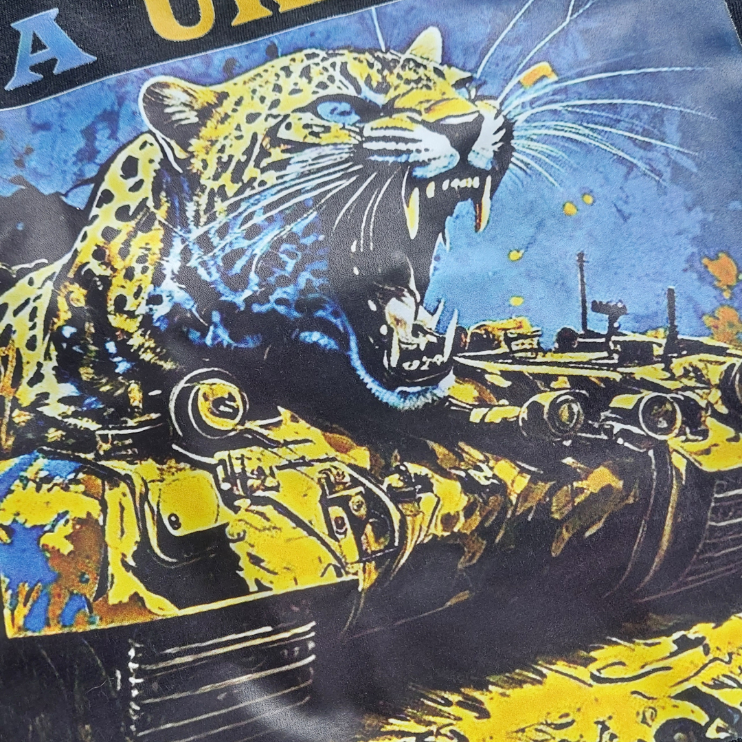 Embody Ukraine's vigor with a Ukrainian TShirt, adorned with a powerful leopard on a tank print in Ukrainian flag colors. Created by Ukraine Sellers, it calls for peace with fervor.