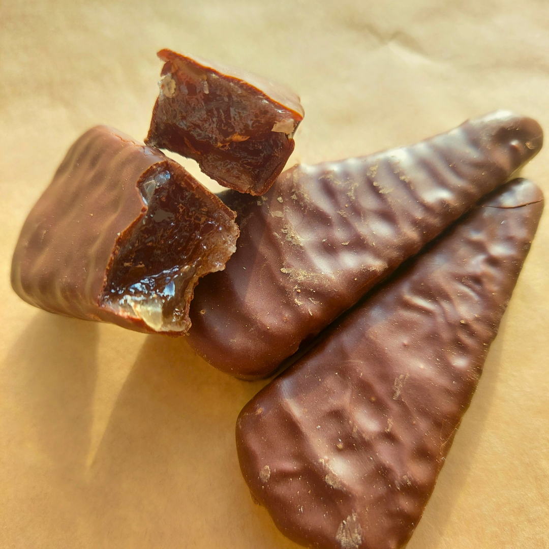 a couple of pieces of chocolate sitting on top of a table