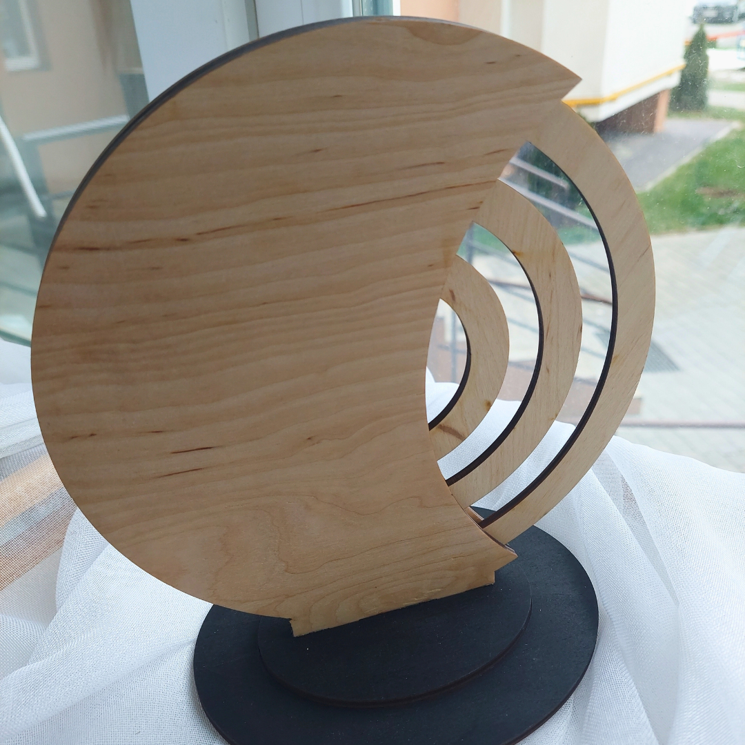 a wooden sculpture sitting on top of a table