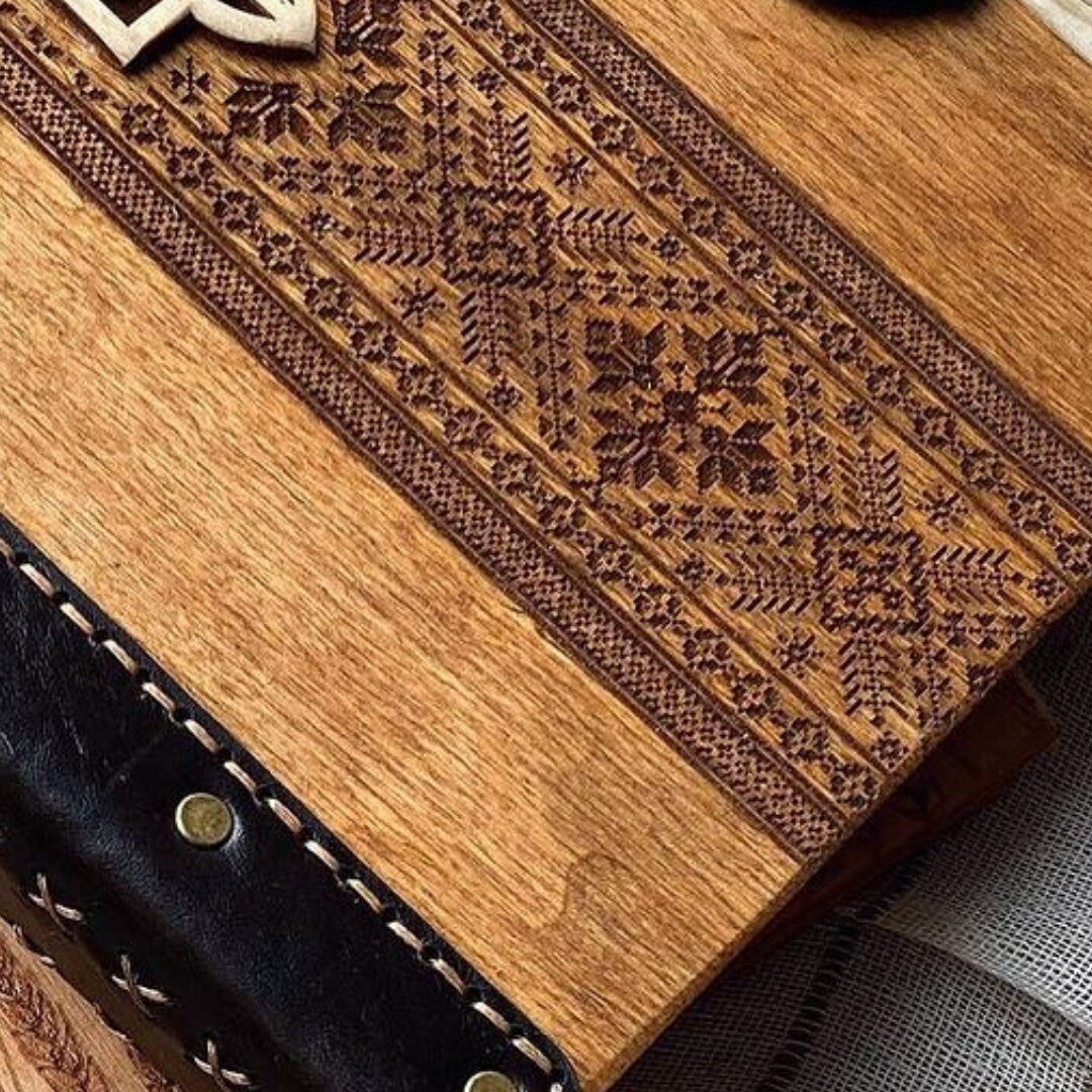 a close up of a wooden case on a table