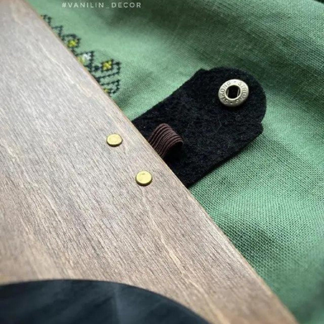 a close up of a wooden object on a green cloth