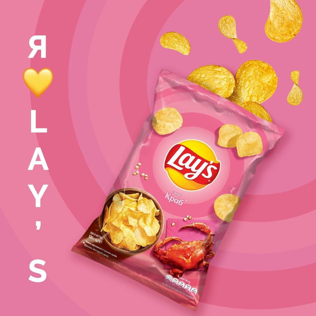 a bag of lays potato chips on a pink background