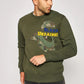 a man wearing a green sweatshirt with a camouflage print