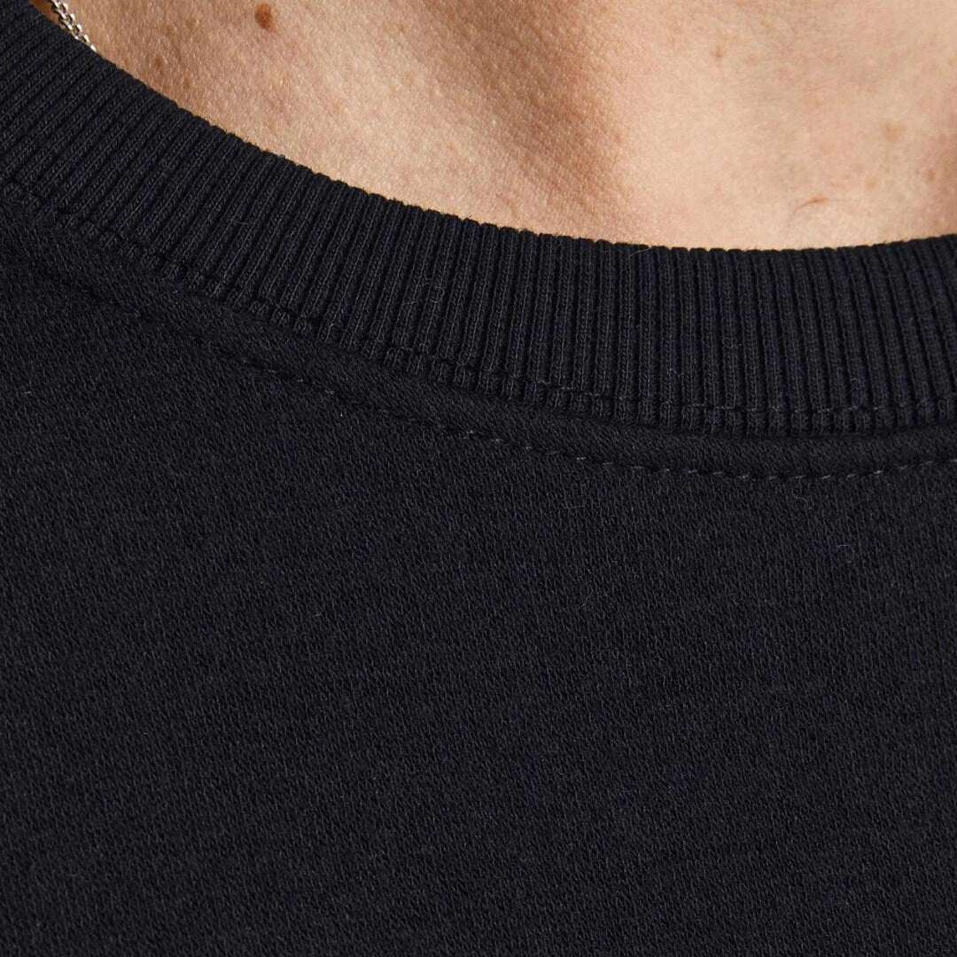 a close up of a person wearing a black shirt