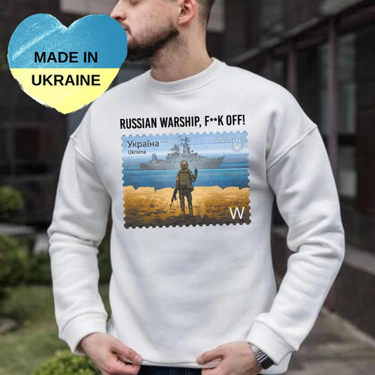 a man wearing a sweater with a picture of a man on it