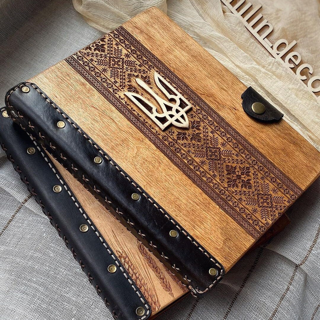 a wooden book with a monogram on it