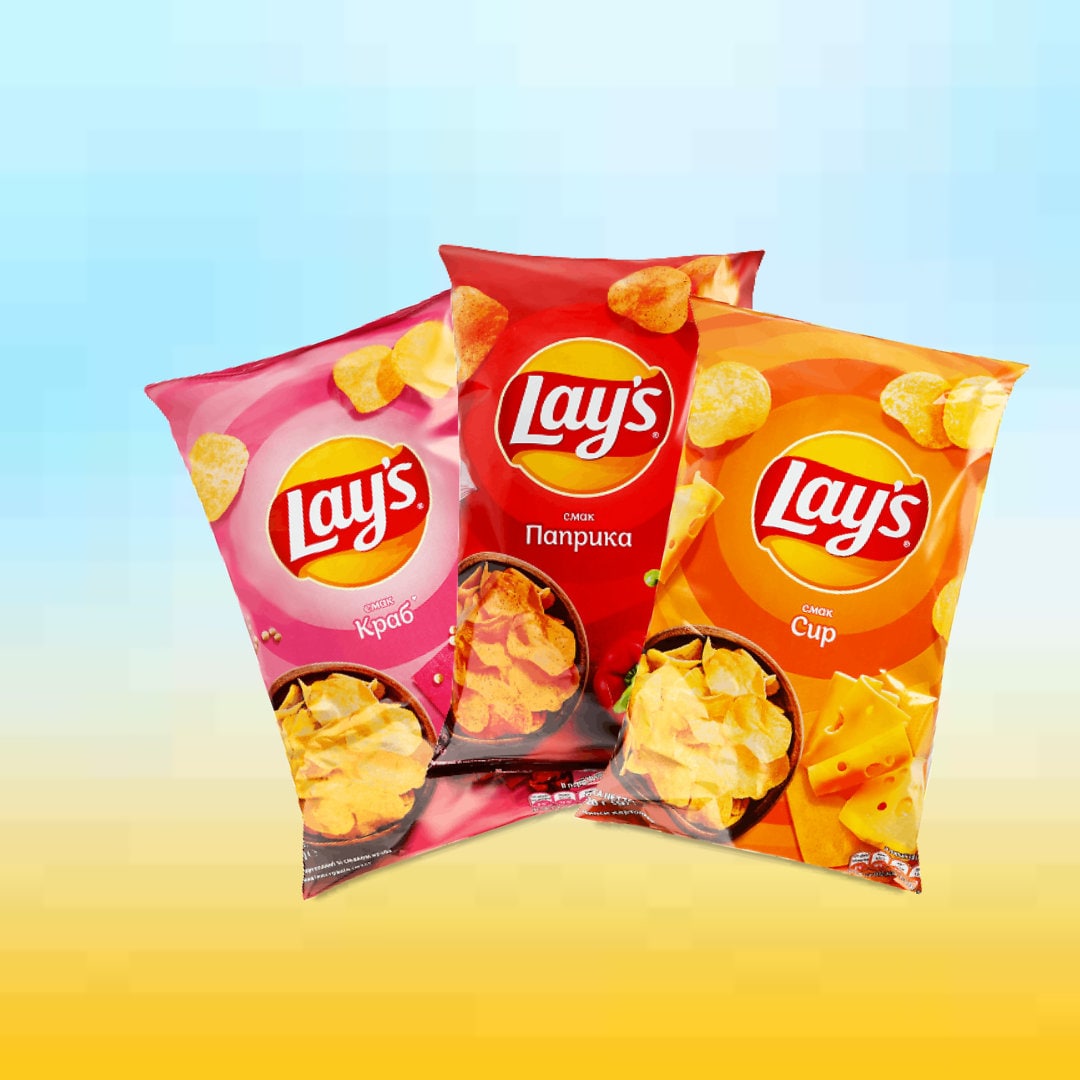 two bags of lays potato chips on a yellow and blue background