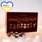 a box of chocolates with a heart in the background