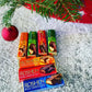 a group of chocolate bars sitting next to a christmas tree