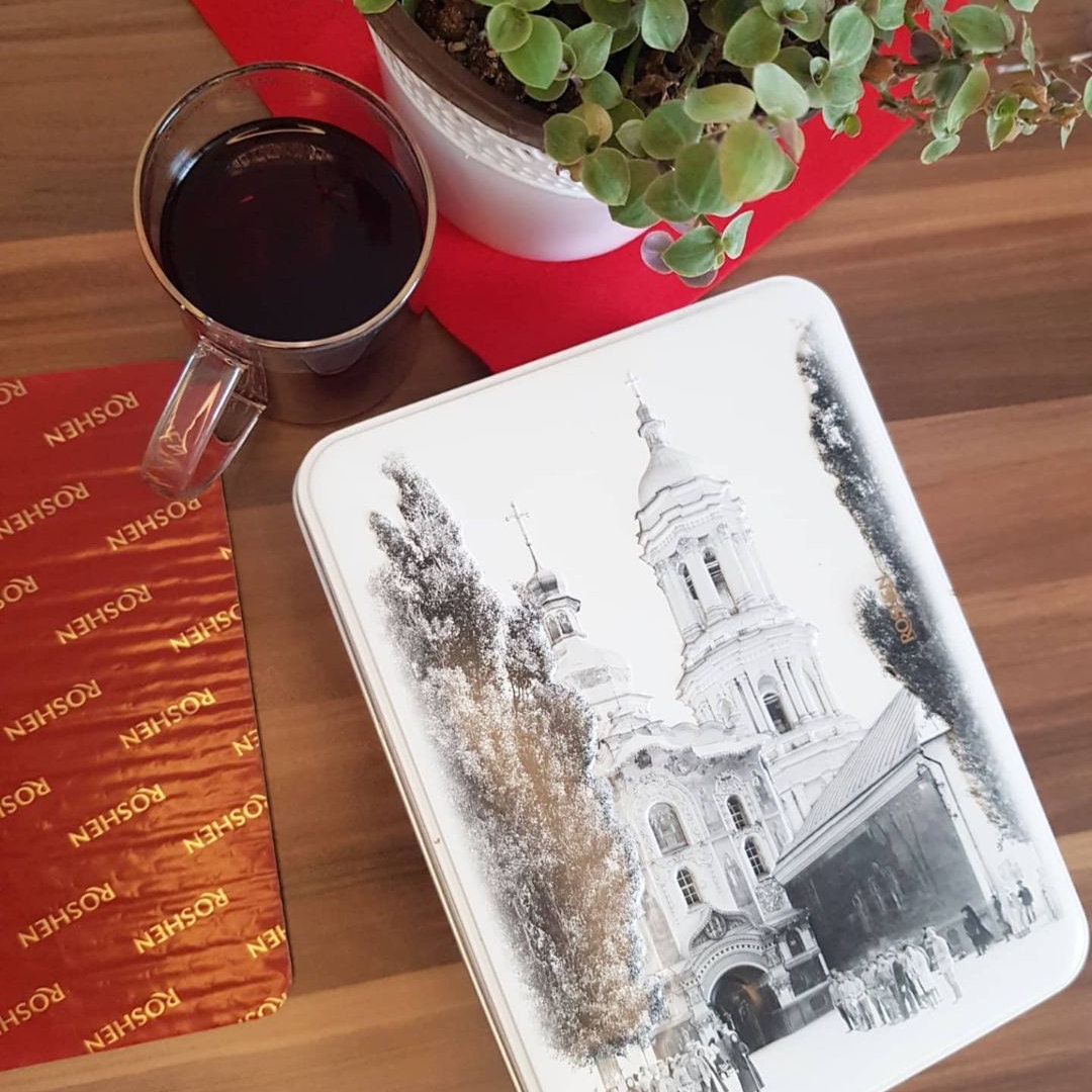 a cup of coffee and a book on a table