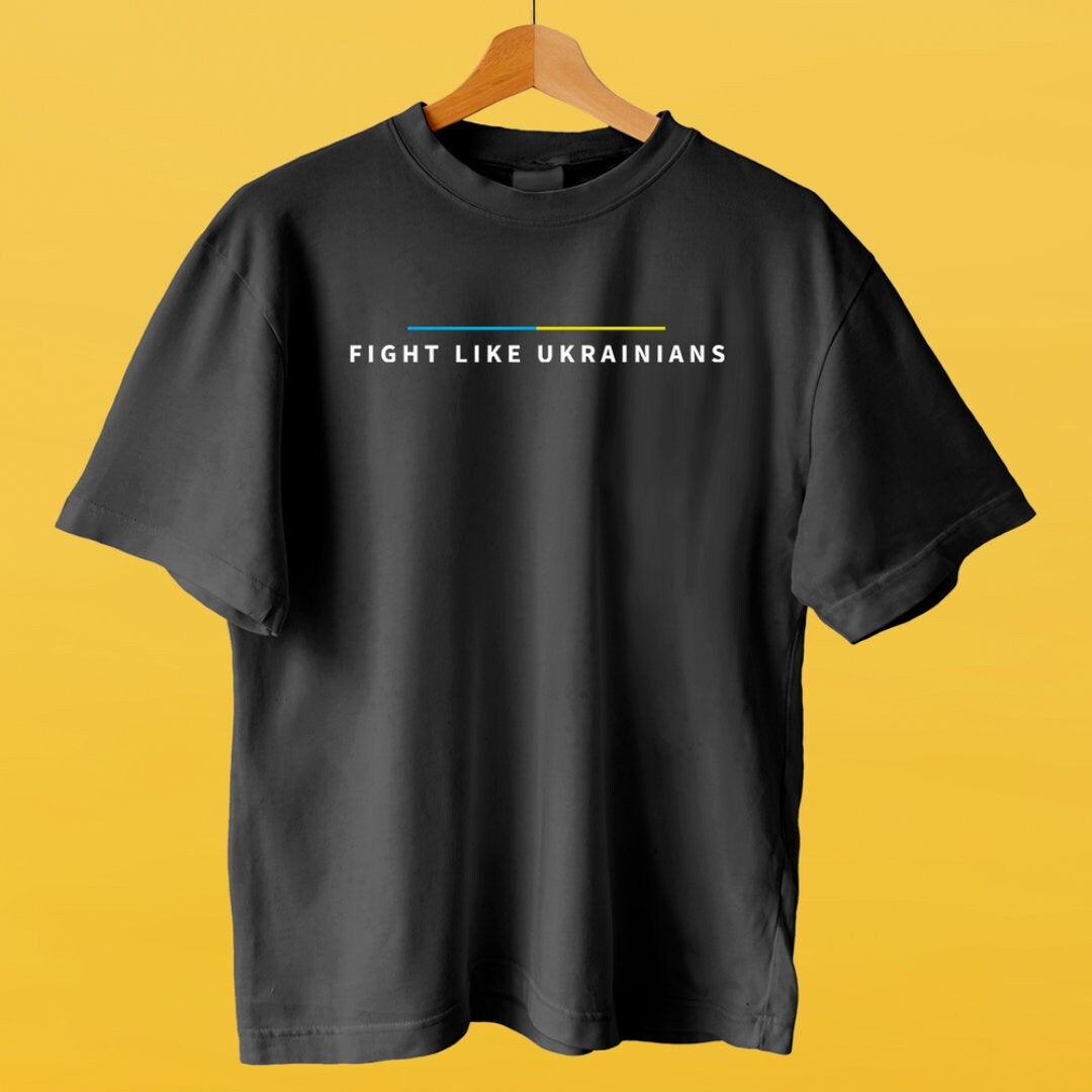 a black t - shirt that says fight like ukraines