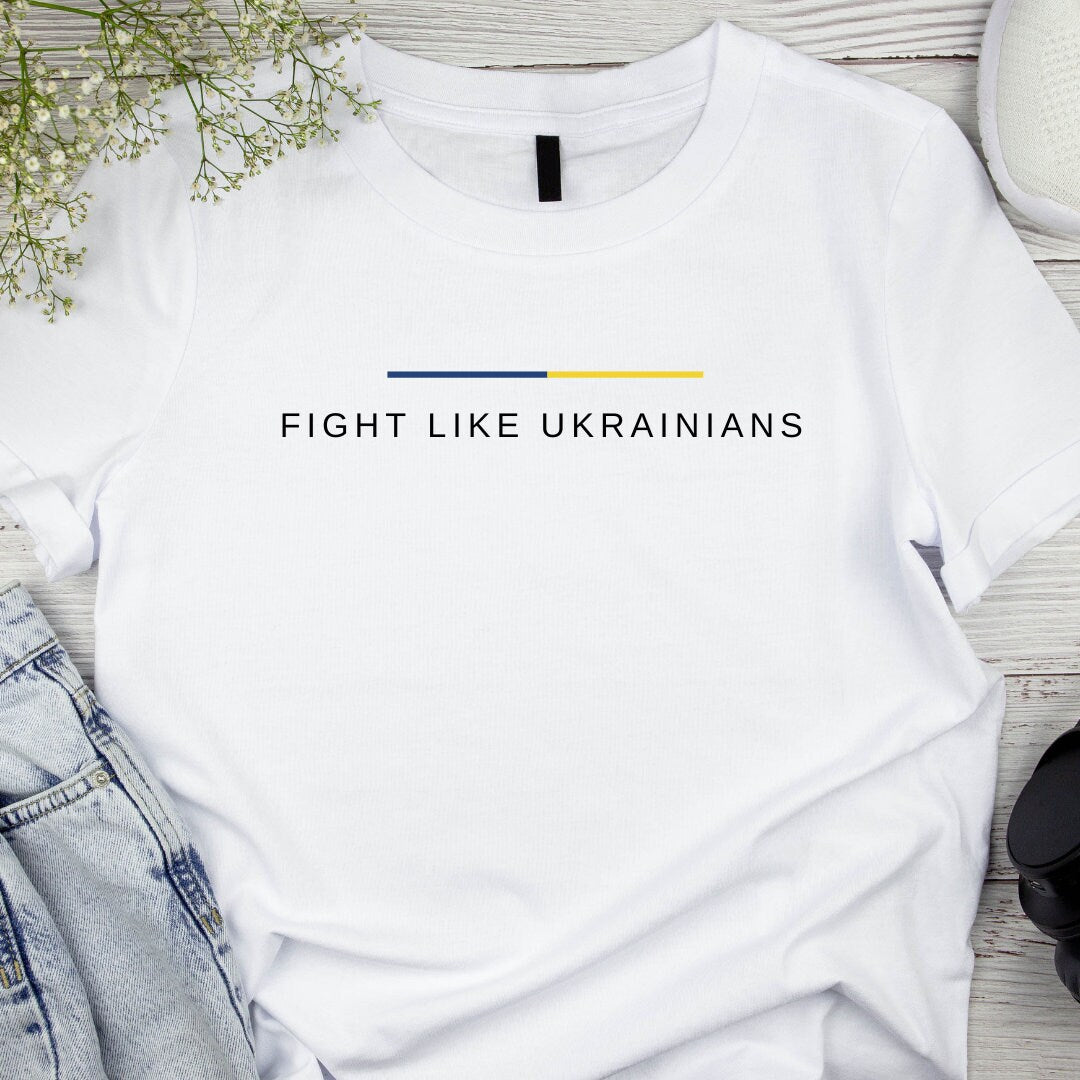 a white t - shirt that says fight like ukraines