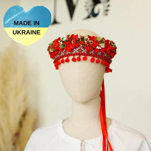 a white mannequin with a red headband on it