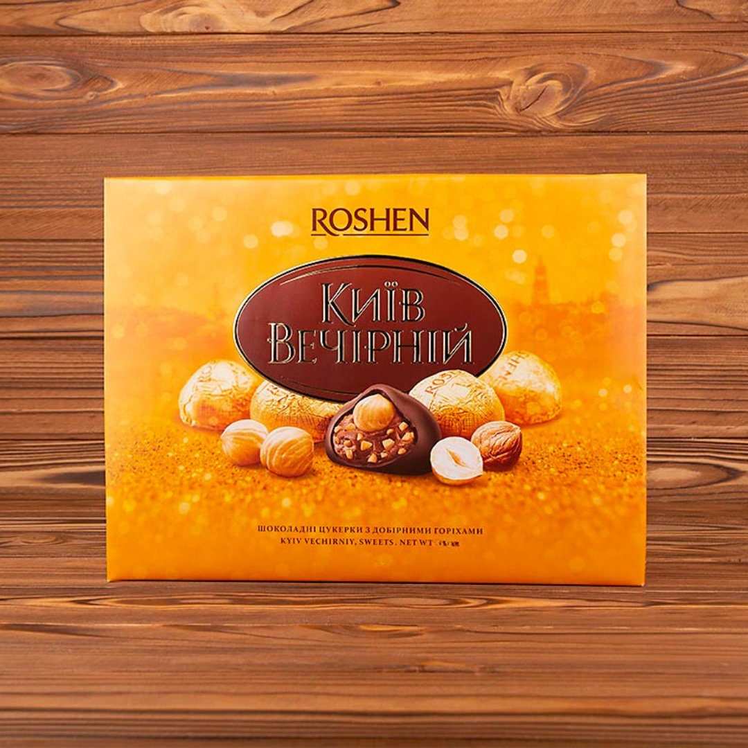 a box of roshen on a wooden surface