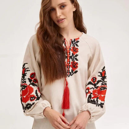 a woman with long hair wearing a white shirt